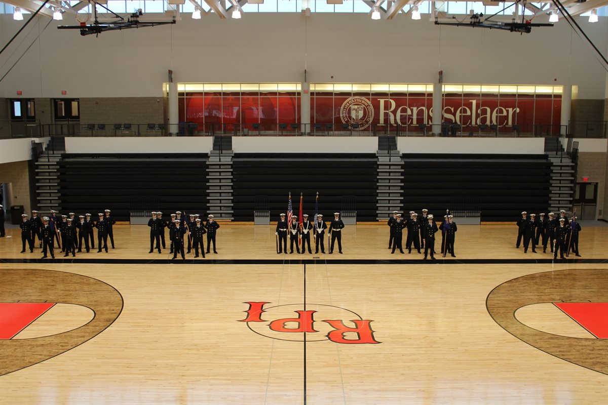 Groups of people in uniform in a RPI gymnasium