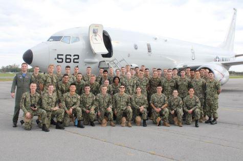 The Ship's Company at Albany Airport with a P-8A Poseidon from VX-1